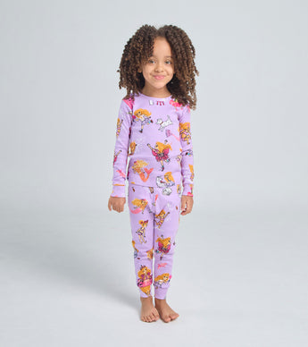 Child wearing Florabelle pajamas with playful storybook illustrations