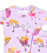Close-up of Florabelle pajama top featuring magical characters and dog