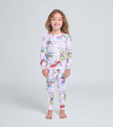 Child wearing How to Babysit a Grandma inspired pajama set with colorful story scenes