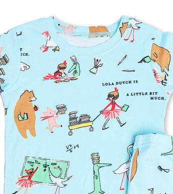 Close-up of Lola Dutch pajama top featuring storybook characters and books