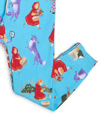 Pajama pants detail with Little Red Riding Hood and wolf characters on blue fabric