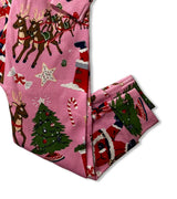 Pajama pants detail with Christmas trees and Santa print on pink fabric