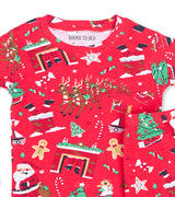 Close-up of red pajama top with Santa, reindeer, fireplace, and Christmas tree designs