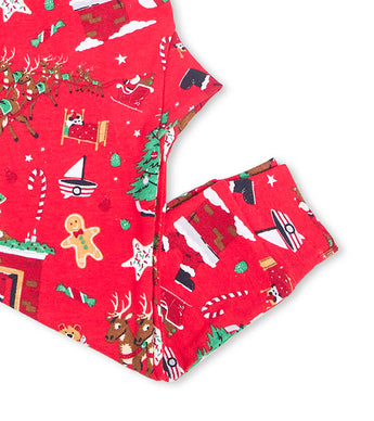 Red pajama pants with festive Christmas patterns including stockings and reindeer