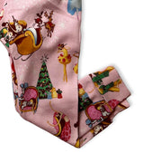 Leg detail of Nutcracker-themed kids pajama set with sleigh and holiday motifs