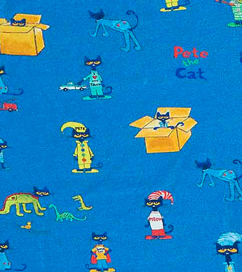 Fabric detail showing Pete the Cat and box illustrations on blue pajamas