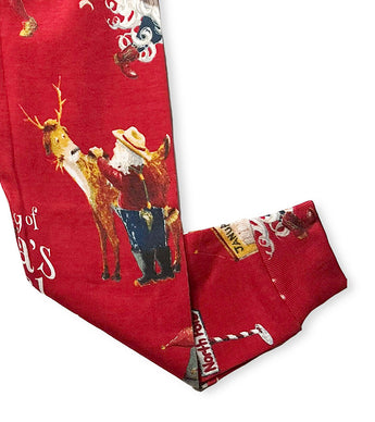 Red pajama pants with Santa and reindeer illustrations inspired by The Story of Santa's Beard