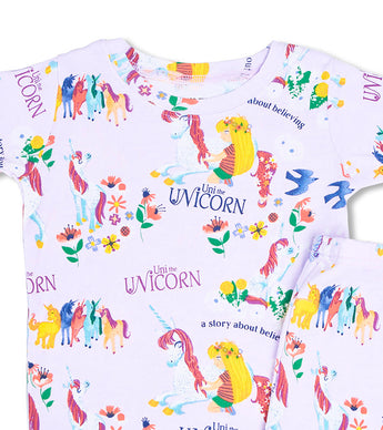 Closeup of Uni the Unicorn pajama top with unicorn and girl illustration