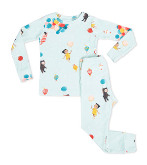 Children’s pajama set with whimsical balloon and character print on pale blue background
