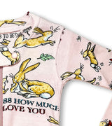 Detail of baby coverall arm with bunny and floral illustrations