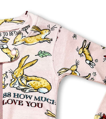 Detail of baby coverall arm with bunny and floral illustrations