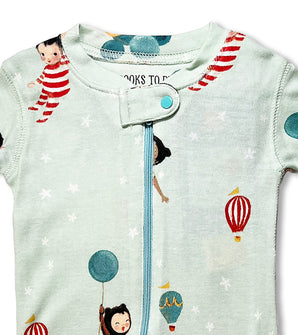 Close-up of baby coverall neckline with playful storybook characters and balloons
