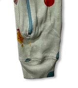 Leg and zipper detail of baby coverall with colorful balloon print