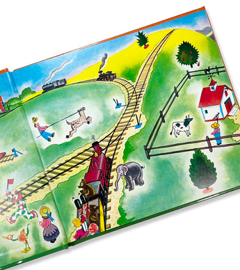 Open pages of The Little Engine That Could showing trains, animals, and countryside