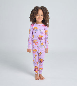 Child wearing Florabelle pajamas with playful characters