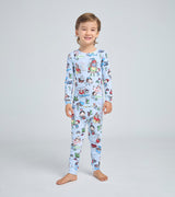 Child wearing blue pajamas with 'How to Babysit a Grandpa' themed print