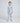 Child wearing blue pajamas with 'How to Babysit a Grandpa' themed print