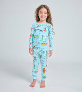 Child wearing Lola Dutch pajamas with whimsical storybook characters