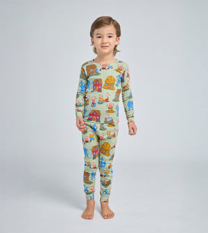 Child wearing Three Little Pigs pajamas with storybook print