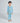 Child wearing blue Rocket dog print pajamas, smiling