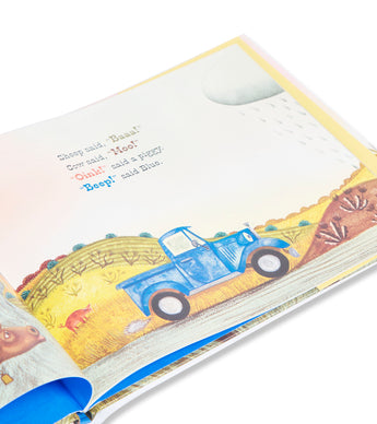 Open page from Little Blue Truck book featuring blue truck illustration