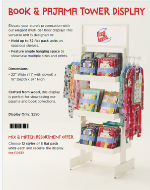 Wooden display tower with shelves holding Books to Bed packs and hanging pajamas